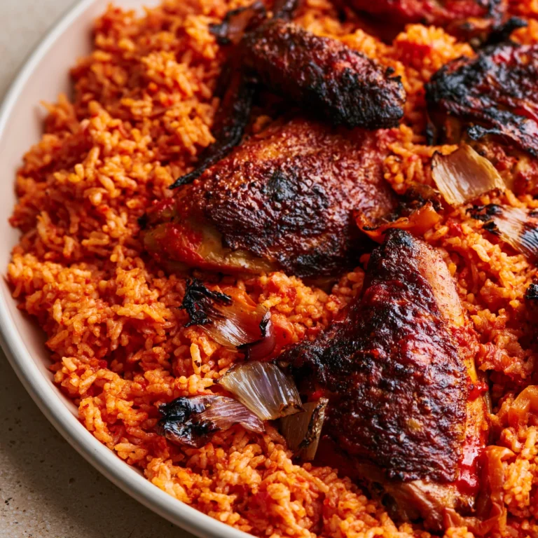 Delicious Jollof Rice served with succulent chicken, a popular West African dish.